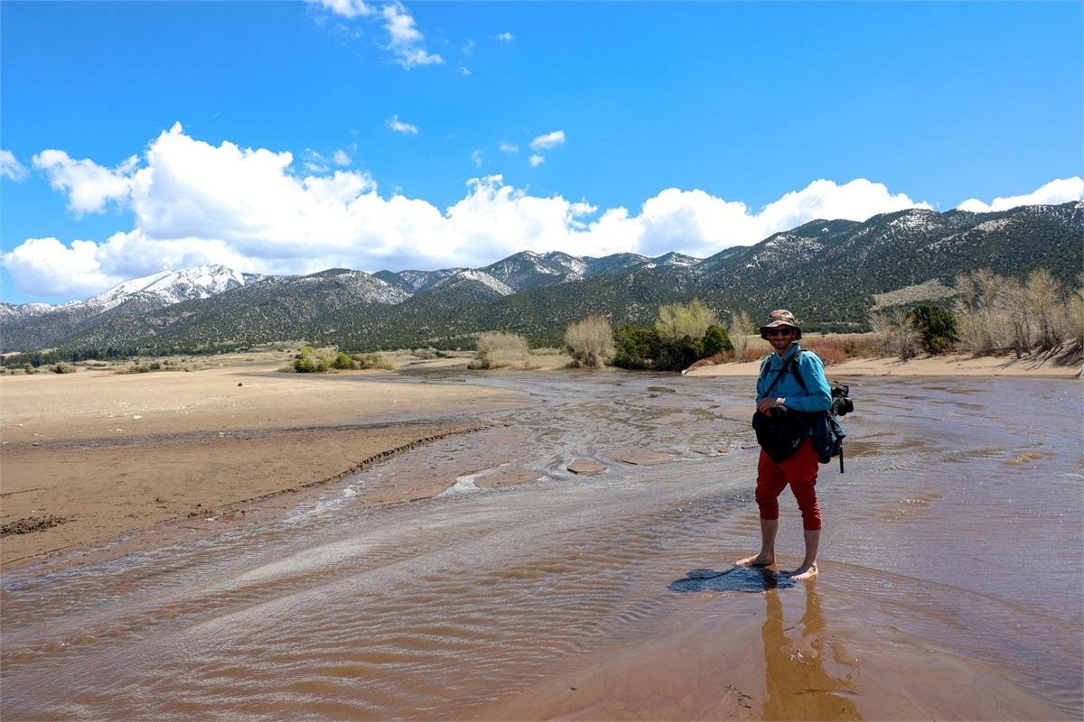 Evan Lightner outdoors in the mountains